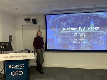 Prof. Olga Kazakova standing at the lecturn in front of her presentation slide