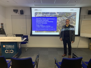 Presenter standing in front of his title slide.