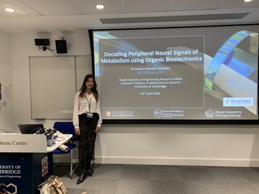 Professor Amparo Guemes Gonzalez standing in front of her title slide
