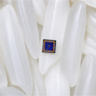 Magnified picture of rice grains with a tiny sensor on one grain.